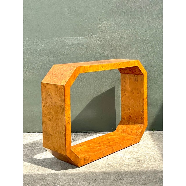 This vintage burl wood console table pairs a bold, geometric octagonal silhouette with the natural swirling patterns...
