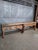 Impressive 325 cm long industrial workbench with a solid, well-used wooden top and original bench vice. The worktop...