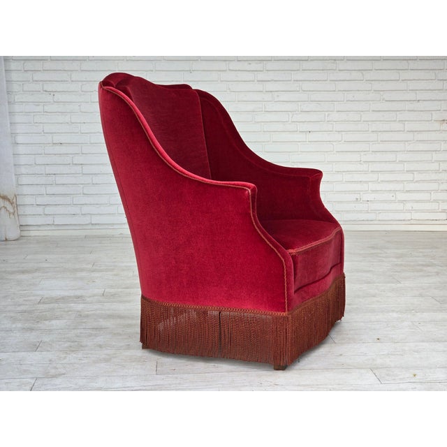 1970s, Danish highback armchair. Original red furniture velour, ash wood legs, springs in the seat. Original very good...