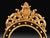 Handcrafted in Italy, this oval mirror features beveled glass within a black frame accented by gold detailing. Carved...
