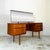 This Austinsuite dressing table dates from the 1960s and features richly coloured wood, striking grain and a large...