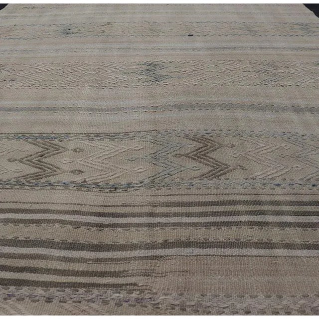Vintage flat-weave Kilim with embroideries in tan, blue-gray with a modern design geometric stripe design Vintage Kilim...