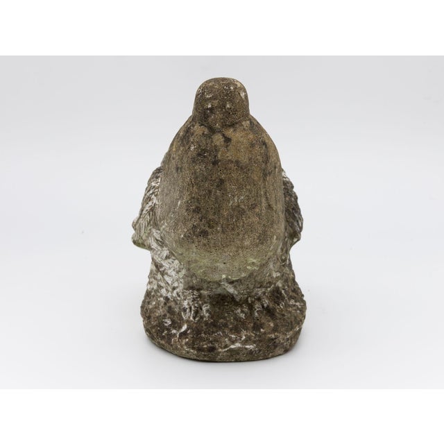 Mid-20th Century concrete garden ornament in the shape of a dove. The dove is perched on a rock with lovely detail on the...