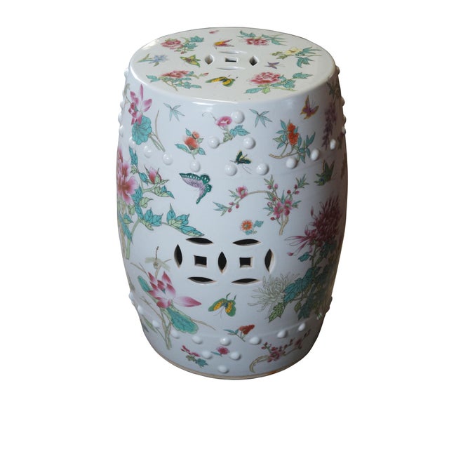 An exceptional mid 20th century Chinese Famille Rose porcelain garden stool. Features a charming floral and fauna design...