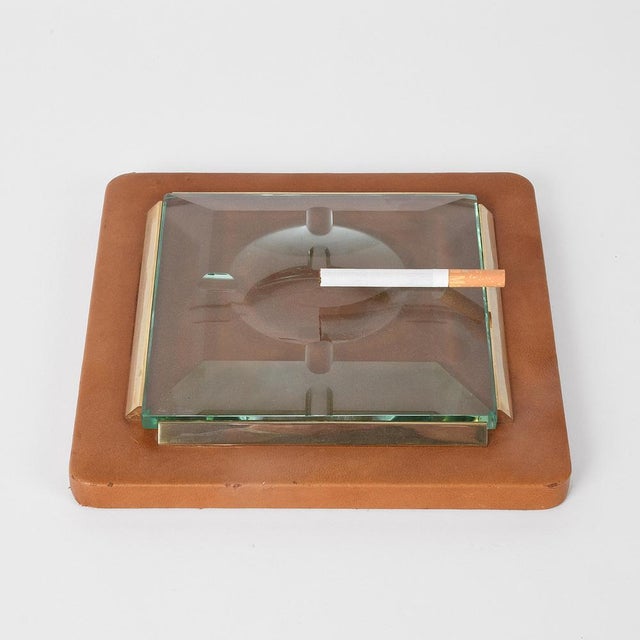 Fontana Arte 1970s. Ashtray in leather, brass and faceted glass. This piece is attributed to the mentioned designer/maker....