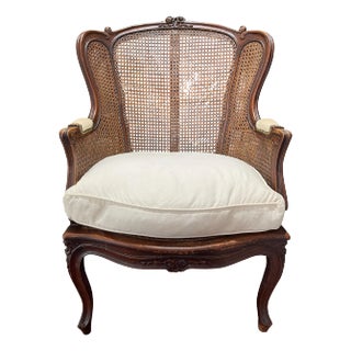 French Louis XVI Style Walnut Caned Bergere, Early 20th Century For Sale