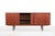 A beautiful Danish design sideboard. Made of teak veneer and solid teak. This sideboard has two sliding doors and four...