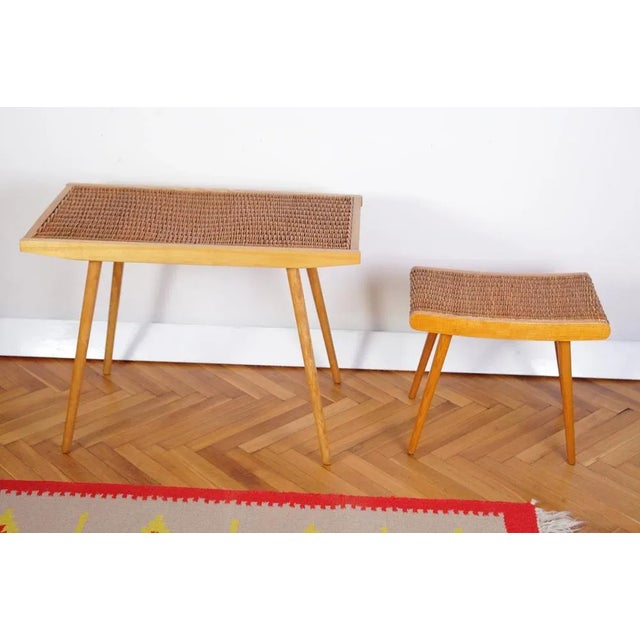 Ash wood frame with wickerwork in excellent condition. Subtle piece. Screwable legs to a table. Marked and produced by...