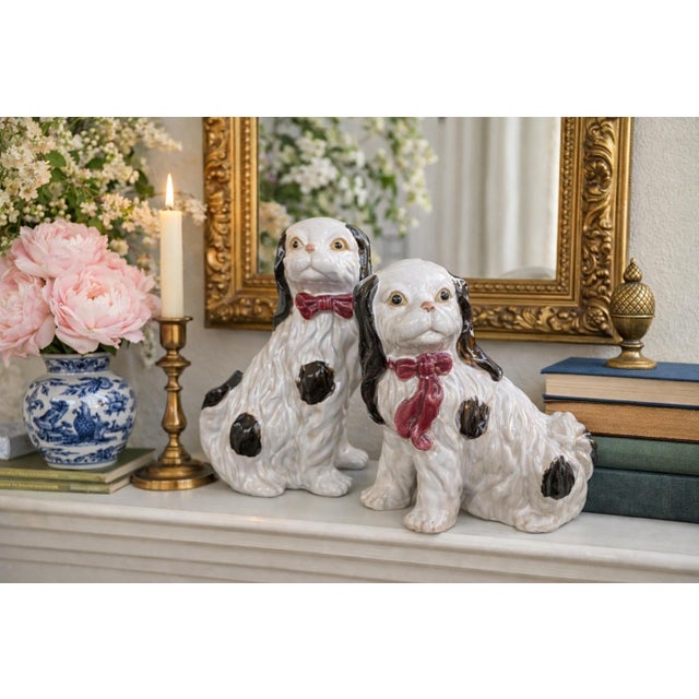 A charming pair of vintage Staffordshire-style Cavalier King Charles Spaniel mantel dogs, beautifully rendered in glossy...