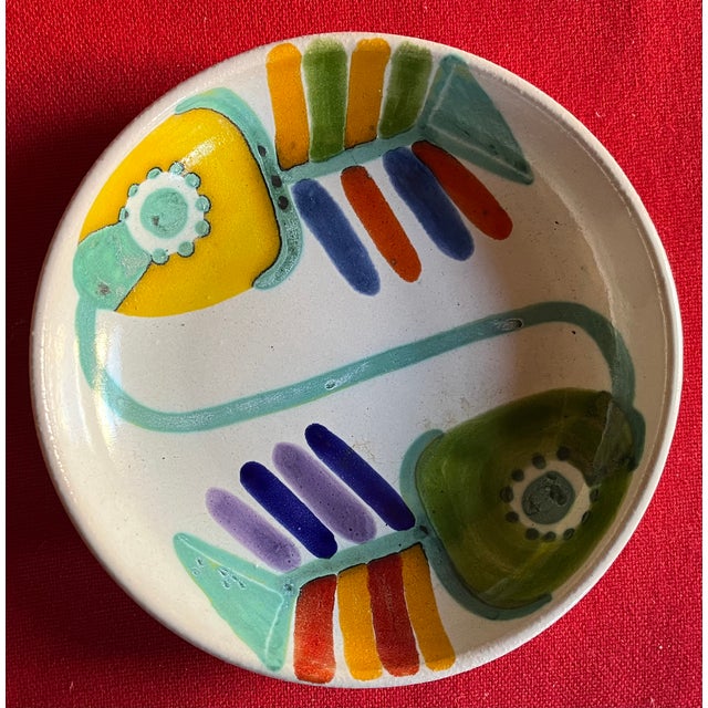 Mid-Century Modern hand painted Italian pottery bowl by Desimone, circa 1960's. Decorated with stylized abstract fish in...