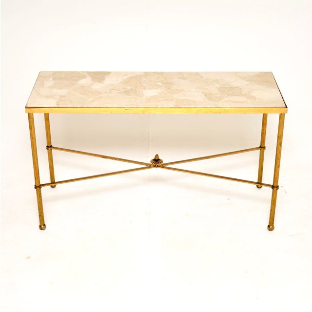 A stylish and very well made vintage French brass and marble coffee table. This was made in France, it dates from around...