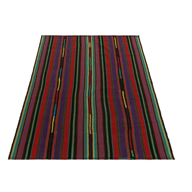 Hailing from Turkey circa 1950-1960, among a rare curation of mid-century chaput kilim rugs family in our collection....