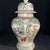 A beautiful pair of Chinese Famille Rose porcelain "General Jars." The white ground is finely hand-painted with a vibrant...