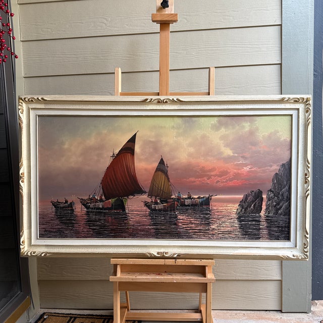 An Italian style oil painting on canvas. The painting depicts mast boats sailing in the ocean with sea stacks with calm...