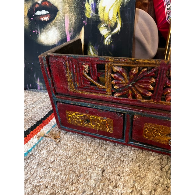 Up for consideration is a beautiful vintage red wooden shelf with carved details and drawers. This would look lovely in...