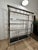 A monumental vintage chrome, brass and glass display étagère dating to the early 1980s. Measuring an impressive 60 inches...