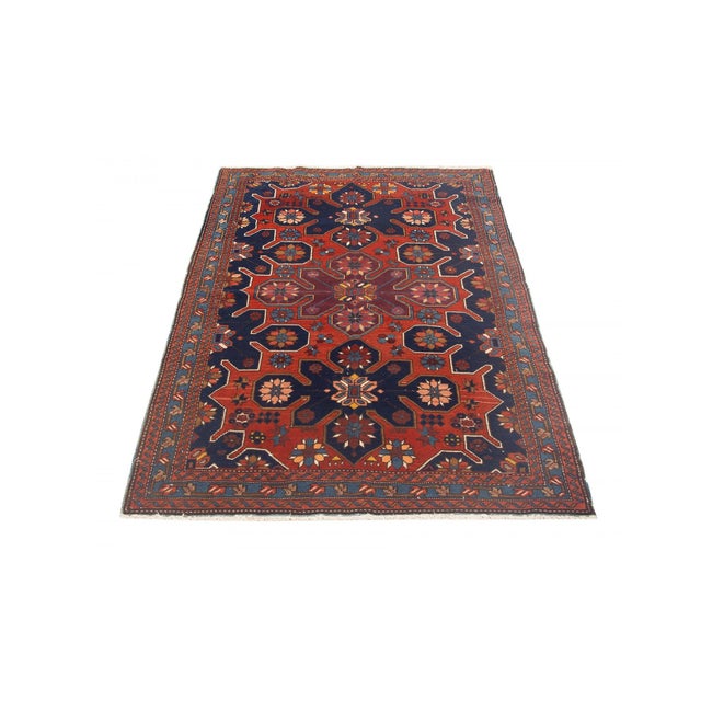 Antique decorative wool handknotted Caucasian rug. Approximately 75-85 years old. In very good condition.
