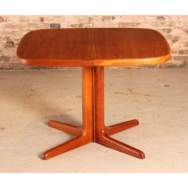 Danish Mid Century extending teak dining table by Skovby, circa 1970s. Can be extended with 2 extension leaves to 200cm to...