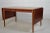 Scandinavian modern desk or dining table by Nils Jonsson for Troeds. Made in Sweden around 1960 with a table top in teak...