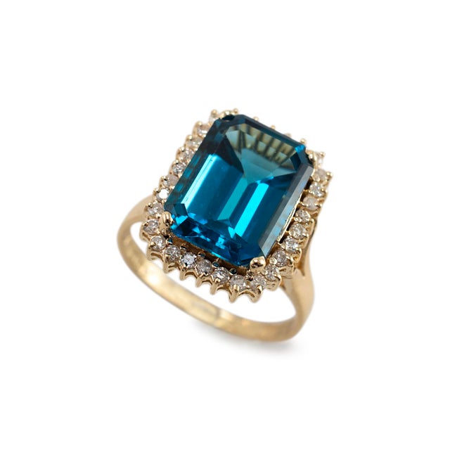 Gender: Ladies Metal Type: 14K Yellow Gold Ring Size: 9 Weight: 6.33 grams One ladies 14K yellow gold diamond and topaz...