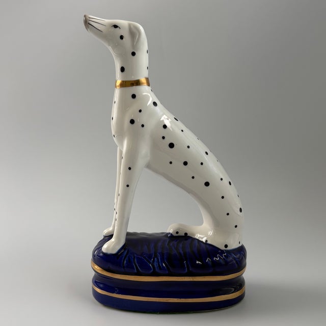 Hand painted Fitz and Floyd Dalmatian in Staffordshire-style pose on blue pillow. The green felt underneath has a black FF...