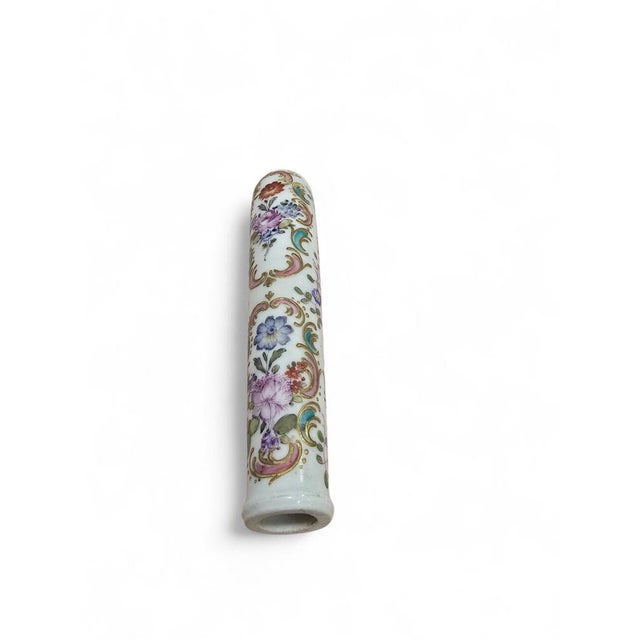 Elegant 19th-century porcelain handle, finely decorated by hand and representative of the refined craftsmanship associated...