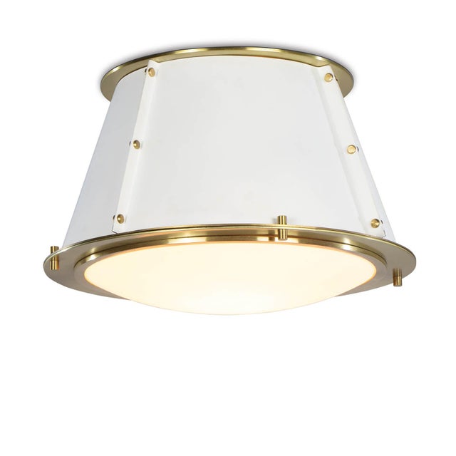 The cone shaped silhouette and natural brass accents of this piece make for an elegantly modern fixture. Install the...
