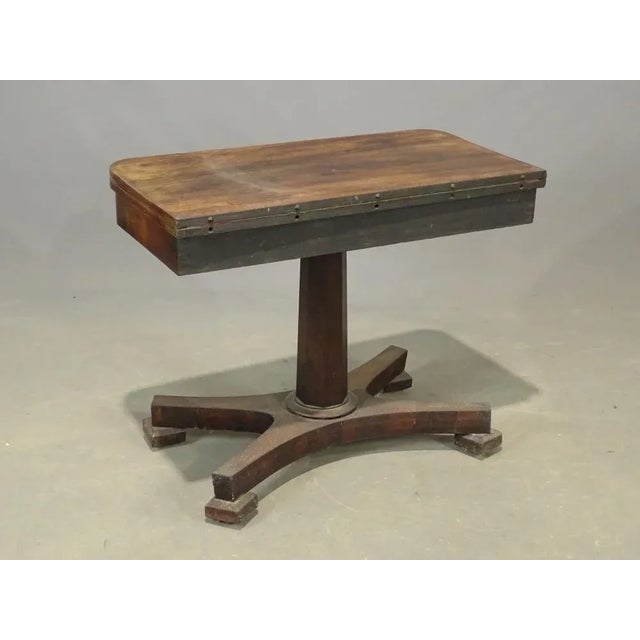 great decorative and useful piece..fits against a wall but then can be pulled out, unfolded and on its green felt top a...