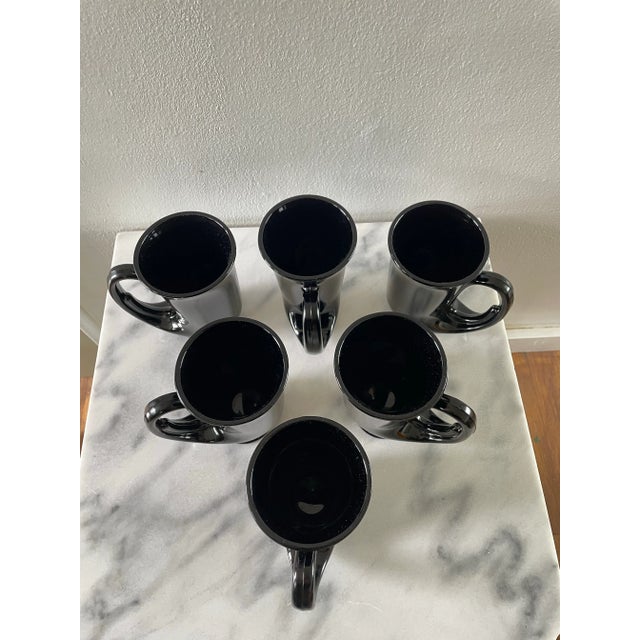 Vintage 1970s black sculpted glass mugs. A complete mood for any bold and brave soul who appreciates a gorgeous black...