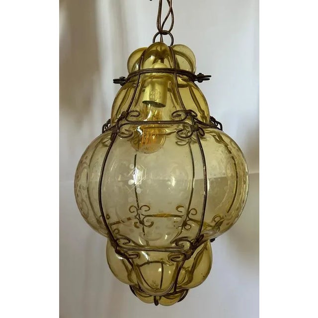 Venetian Murano Glass Lanterns. Elegantly decorated. The hight indicated in the dimensions section includes the chain. The...