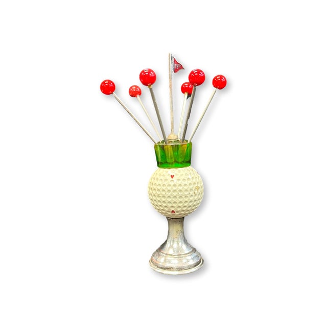 Mid 20th century English golf theme cocktail pick set featuring a silverplate stand with a mounted golf ball form and...