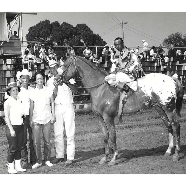 Black and white photograph of Chief Hands H. in the winner's circle at Marble Downs in Carthage, Missouri. African...