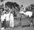 Black and white photograph of Chief Hands H. in the winner's circle at Marble Downs in Carthage, Missouri. African...