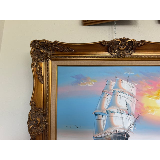 This beautiful modern oil on canvas depicts a majestic tall ship sailing across rolling blue waves beneath a luminous...