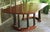 Striking Neoclassical mahogany dining table made by renowned furniture designer Alfred Sharp. Table top has a squared oval...