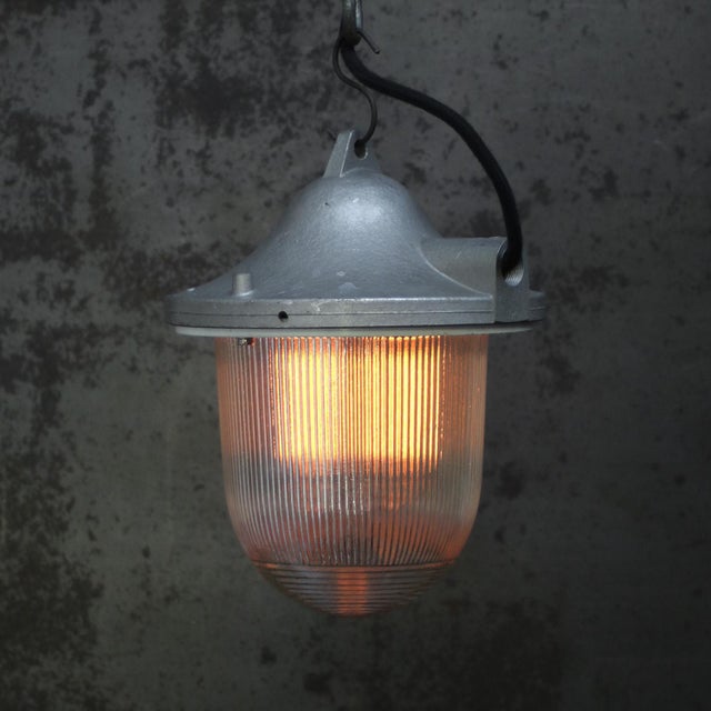 Grey pendant lamp with clear striped glass Cast aluminium top E27 / E26 Up to 250V (Europe/UK Standard).The wiring of this...