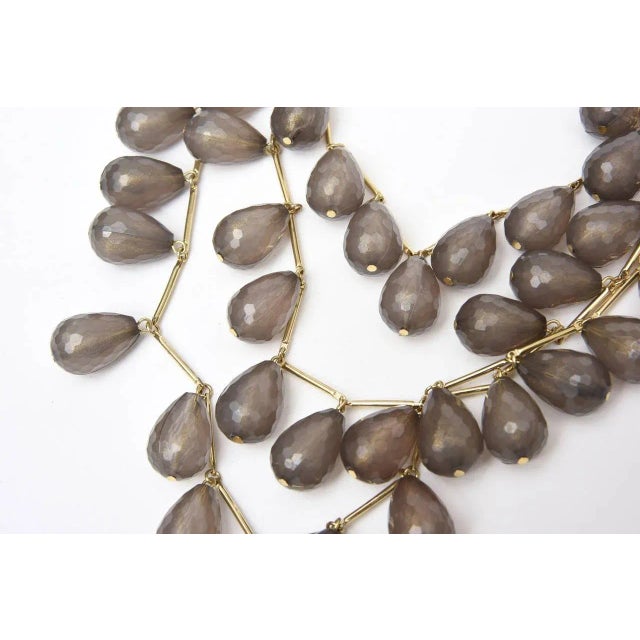 This is part of Chairish’s Costume Jewelry assortment. Three strands of gilt metal and gray resin coffee bean shaped beads...