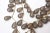 This is part of Chairish’s Costume Jewelry assortment. Three strands of gilt metal and gray resin coffee bean shaped beads...