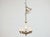 A refined Italian Midcentury chandelier pairing smooth alabaster with finely cast gilt bronze. The composition centers on...