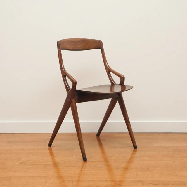 Sleek and modern, this set of four mid-century Italian dining chairs is sure to make a design statement. Manufactured in...