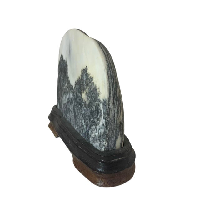 An excellent mid-size dreamstone depicting a mountainous river landscape. Mined from the Cangshan mountain in Yunnan...