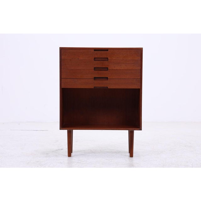 Vintage chest of drawers from the 1960s with five drawers and a spacious open compartment. Its simple design, warm-grained...