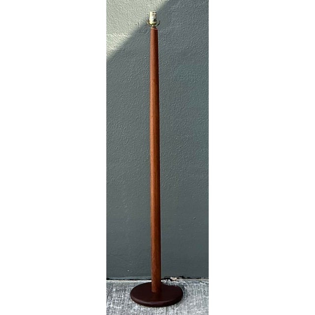 This exquisite Danish Modern floor lamp is a masterclass in Mid-Century Modern minimalism, celebrating the rich grain and...