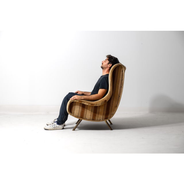 The larger sibling of Zanuso’s Lady chair, designed for Arflex using Pirelli foam rubber over a sculpted frame. Generous...