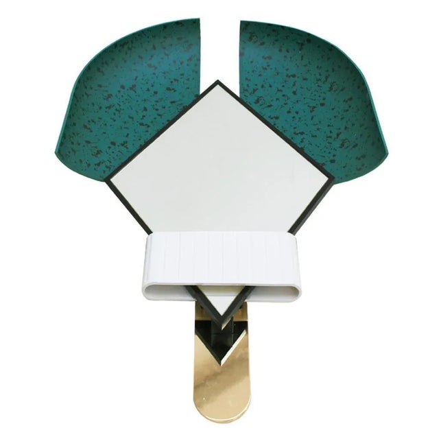 Mirror mod. ''Bonnet'' designed by Elena Salmistraro. Composed of bevelled mirror, white lacquered ring and two green...