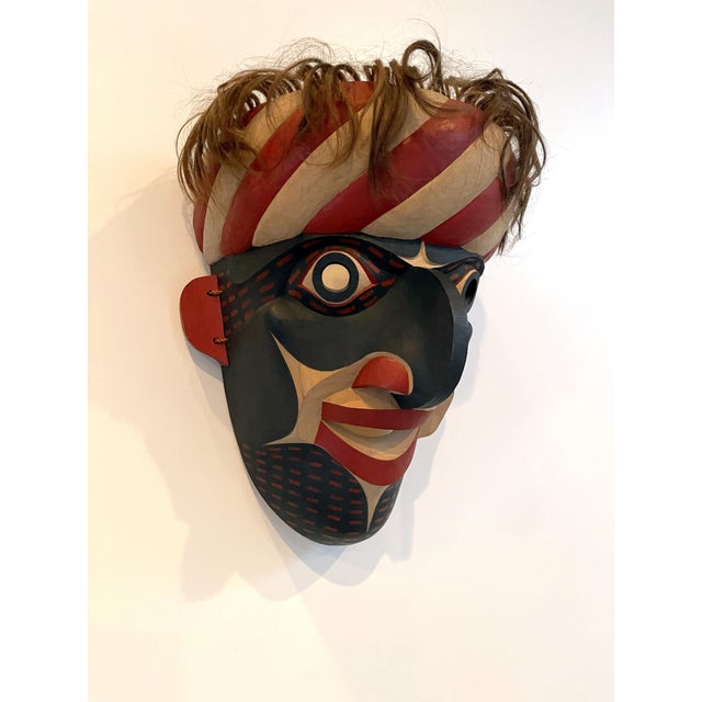 A striking carved and painted mask in the tradition of the Native Indian tribes from Pacific Northwest Coast by David...