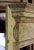 Antique, petite scale, English Georgian style 19th century pine mantle. The pulvinated frieze features an intricately...