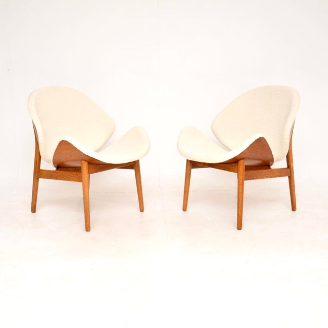 A stunning and iconic pair of Danish vintage lounge chairs by Hans Olsen. They were made by N.A Jorgensen in Denmark, and...