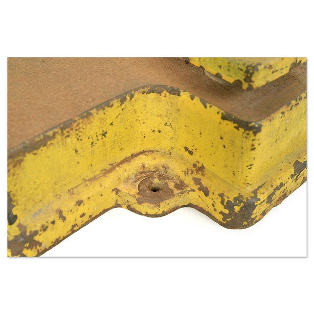 Antique yellow lacquered cast iron press with a central screw, boasting a simple yet powerful industrial design. Its...