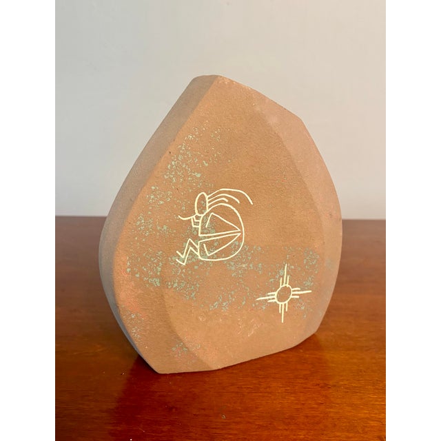 This vintage Southwestern ceramic vase reflects design traditions associated with Native American pottery of the American...